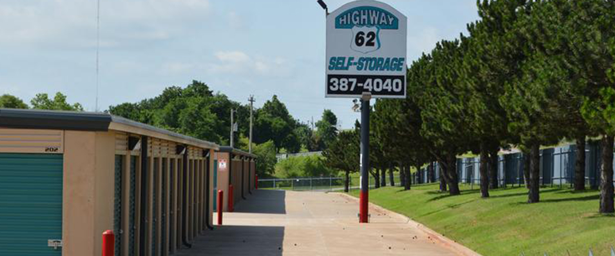 Row of storage units and the Highway 62 Self-Storage sign in Newcastle, Oklahoma